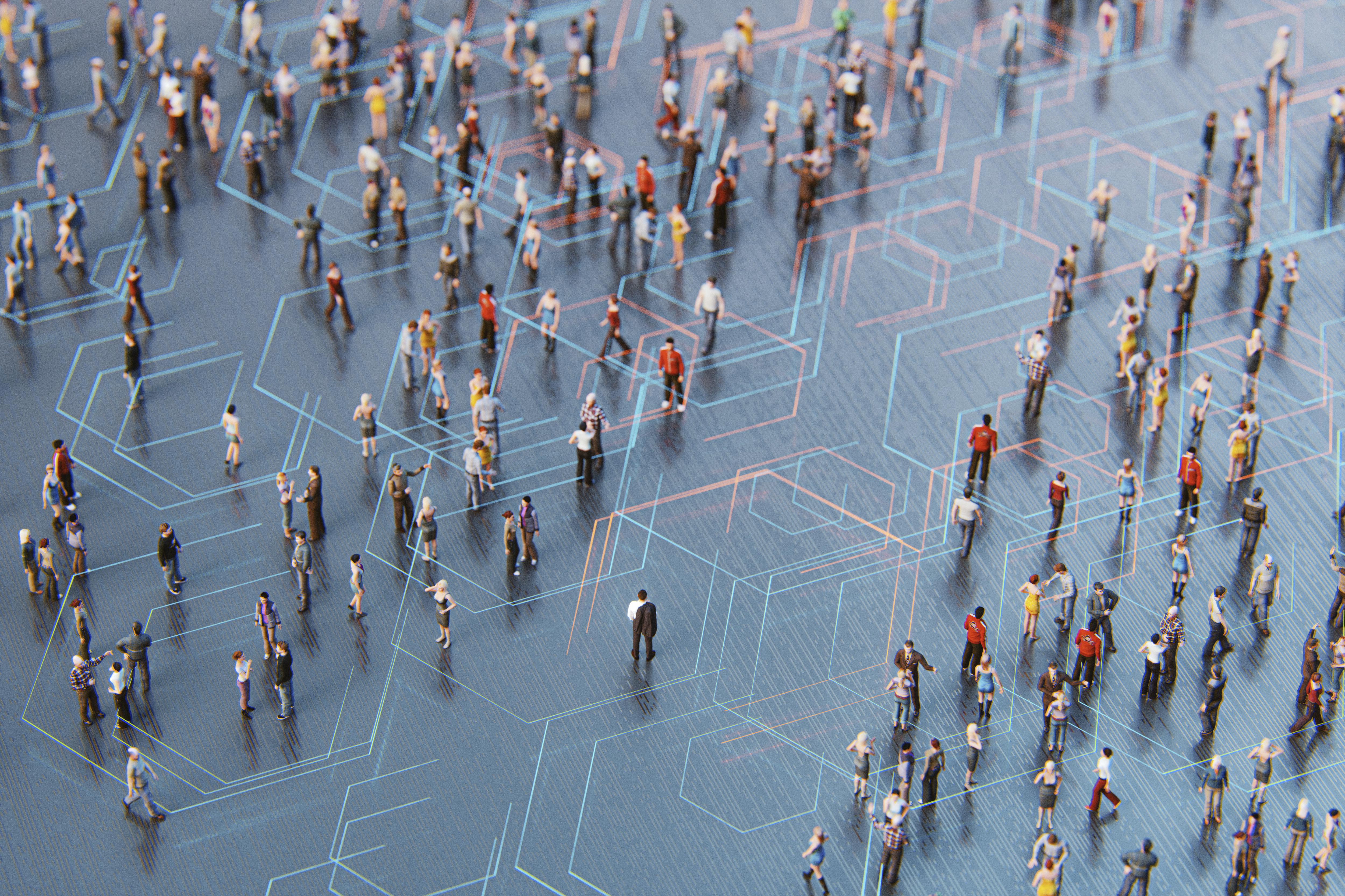 Overhead shot of many people walking on a motherboard grid