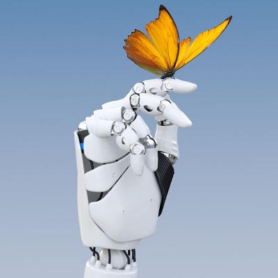 A butterfly alights on a robotic hand