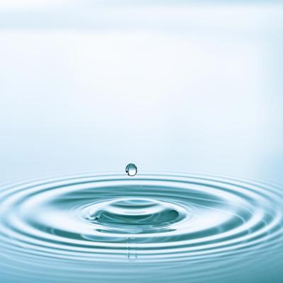 A drop of water above a pool of water